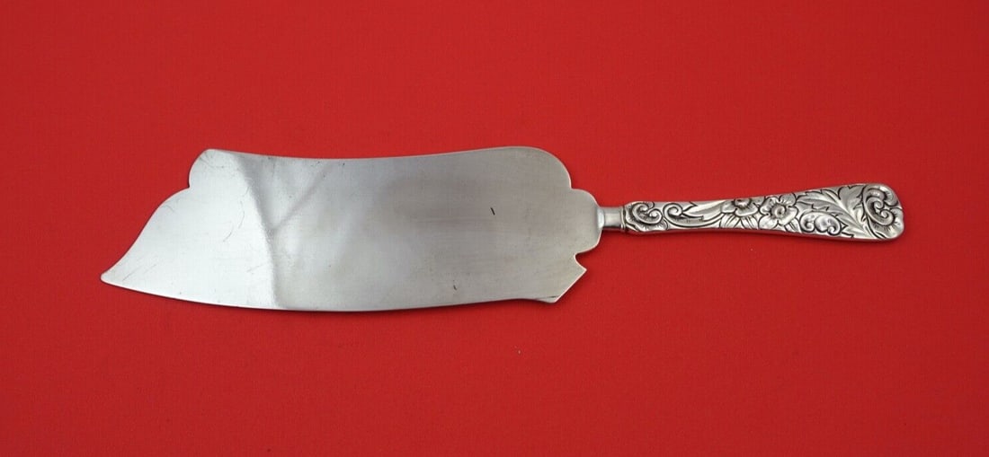 Durgin Scroll Sterling Silver Ice Cream Slice Knife 9 7/8": Durgin Scroll Sterling Silver Ice Cream Slice Knife 9 7/8" This exquisite ice cream slice by Durgin features a beautiful Scroll pattern and is crafted from high-quality sterling silver. With a flat ha