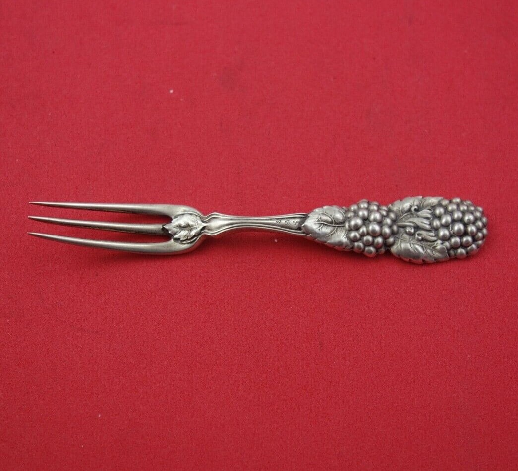 Tiffany & Co Blackberry Sterling Silver Strawberry Fork 4 1/4" Monogrammed: Tiffany & Co Blackberry Sterling Silver Strawberry Fork 4 1/4" Monogrammed This exquisite sterling silver strawberry fork is part of the Blackberry pattern by Tiffany & Co., renowned for its elegant d