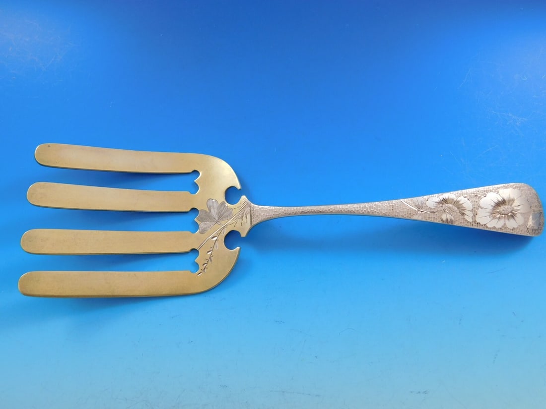 J.E. Caldwell Brite-Cut Sterling Silver Asparagus Fork Gold Washed 10 1/4": J.E. Caldwell Brite-Cut Sterling Silver Asparagus Fork Gold Washed 10 1/4" Discover the exquisite craftsmanship of this Brite-Cut asparagus fork by J.E. Caldwell, crafted from sterling silver. This el