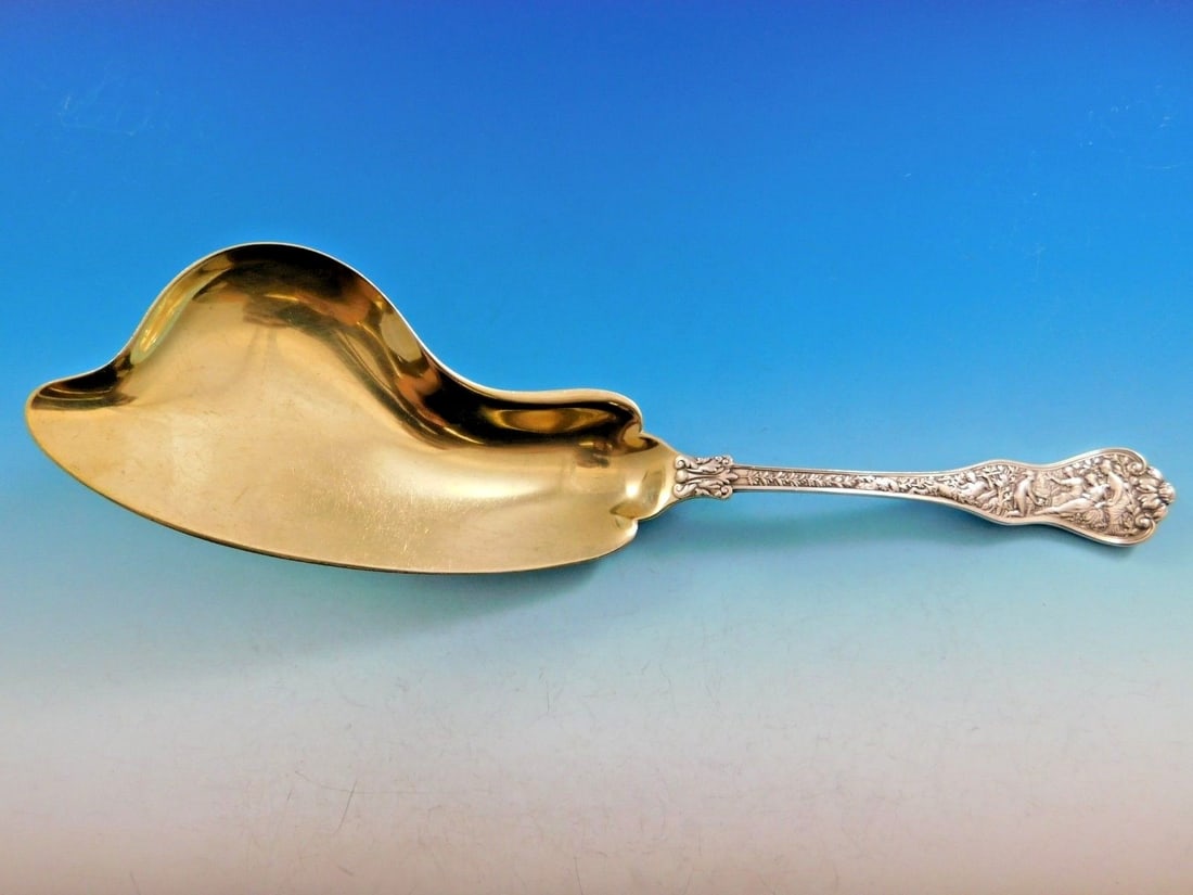 Tiffany & Co Olympian Sterling Silver Fish Server Gold Washed 11 3/4": Tiffany & Co Olympian Sterling Silver Fish Server Gold Washed 11 3/4" Introducing the stunning Olympian Fish Server by Tiffany & Co., crafted from high-quality sterling silver and elegantly gold-washe