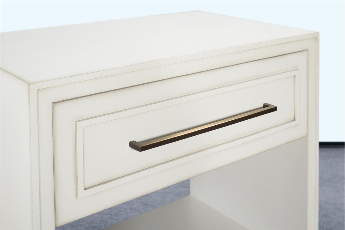 Wilmont Venetian White Nightstand with Spacious Storage: Wilmont Venetian White Nightstand with Spacious Storage Enhance your bedroom with the Chic Wilmont Nightstand, designed to provide ample storage while adding a touch of elegance. This nightstand featu