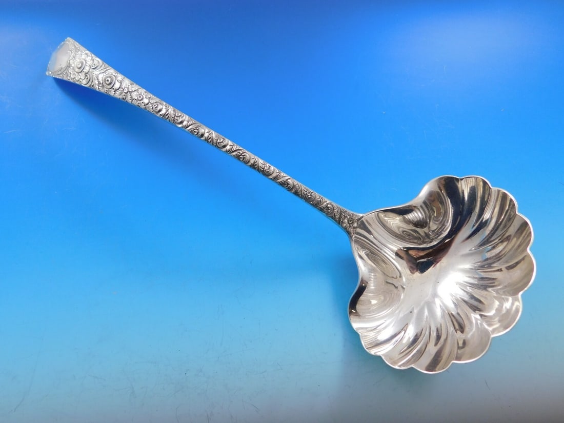 Tiffany & Co Antique Engraved Sterling Silver Soup Ladle Fluted 11.5": Tiffany & Co Antique Engraved Sterling Silver Soup Ladle Fluted 11.5" This exquisite Antique Engraved Soup Ladle by Tiffany & Co. showcases the timeless elegance of sterling silver craftsmanship. Feat