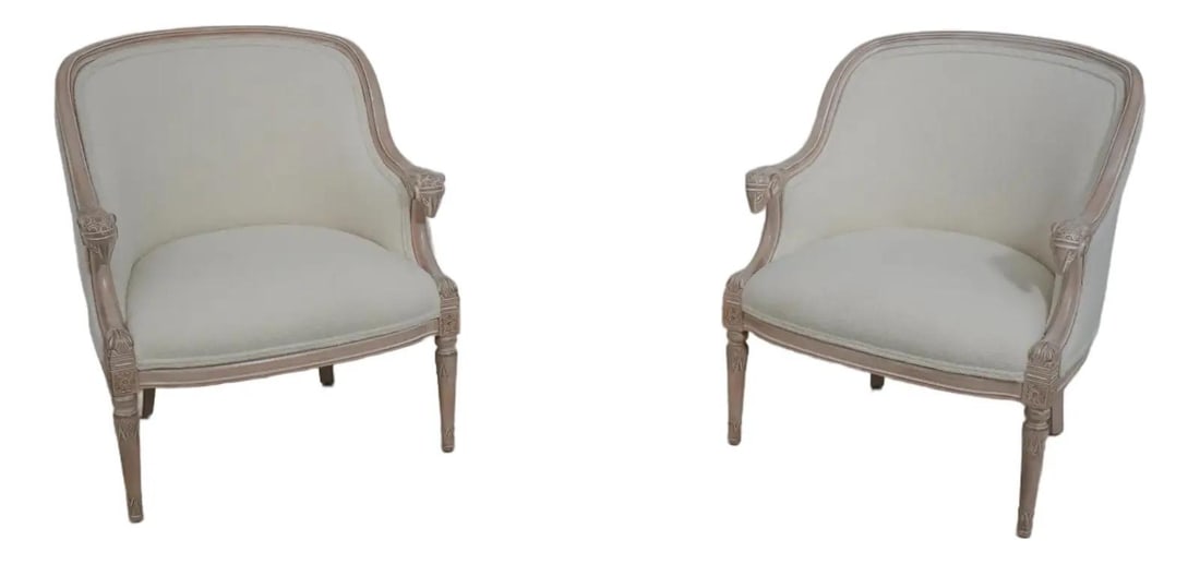 Set of Two Regency Style Boucle Upholstered Armchairs with Rams Head Detail: Set of Two Regency Style Boucle Upholstered Armchairs with Rams Head Detail This pair of French Louis XVI style chairs features fine carved details with distinctive rams head accents. The chairs are c