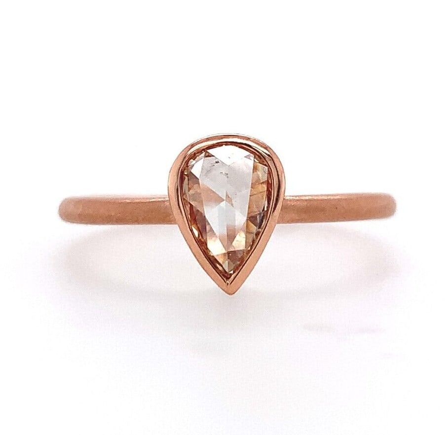 14k Rose Gold .39ct Champagne Diamond Bezel Ring Size 6.25 GIA Certified: 14k Rose Gold .39ct Champagne Diamond Bezel Ring Size 6.25 GIA Certified This exquisite 14k rose gold ring showcases a stunning bezel set rose cut pear shape diamond, weighing 0.39 ct. The diamond fea