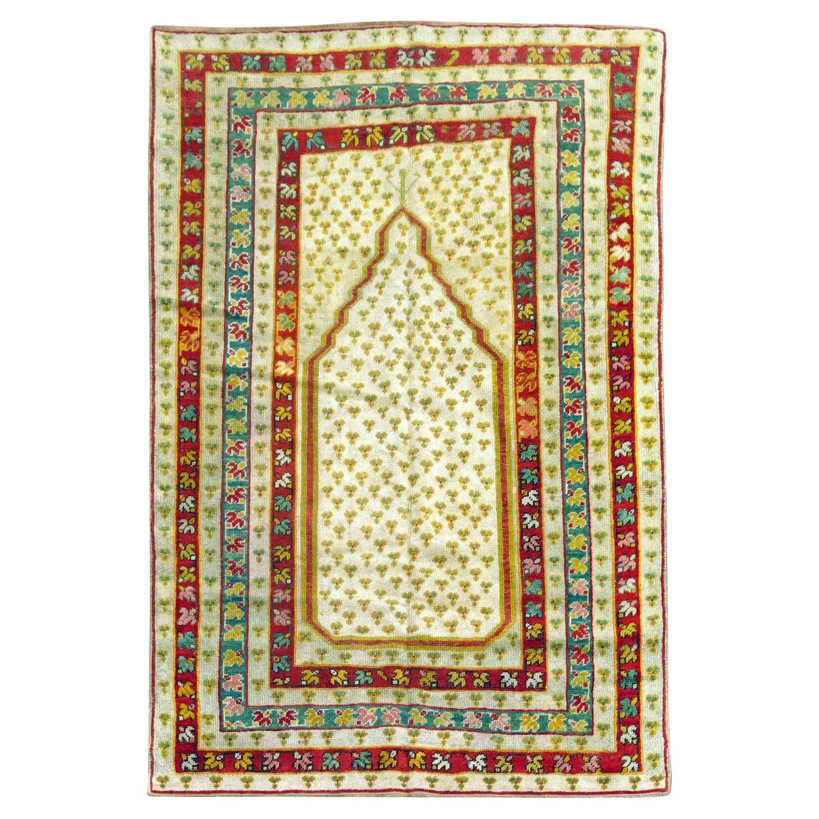 Antique Turkish Ghiordes Prayer Rug Early 20th Century Wool 44 x 64: Antique Turkish Ghiordes Prayer Rug Early 20th Century Wool 44 x 64 This exquisite Antique Turkish Ghiordes Prayer Rug features a vibrant ivory field with a captivating futurist design. Handcrafted in