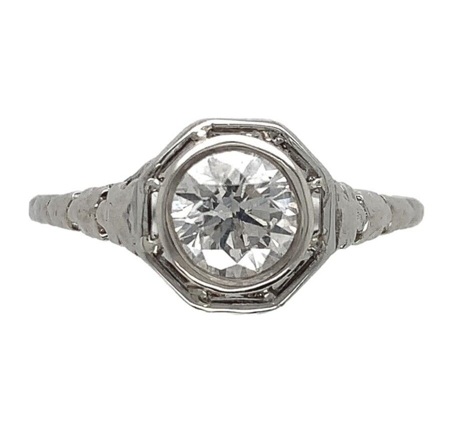 Art Deco 18k White Gold .60ct Diamond Filigree Ring GIA Guaranteed: Art Deco 18k White Gold .60ct Diamond Filigree Ring GIA Guaranteed Experience the elegance of the Art Deco era with this stunning 18k white gold ring featuring a .60ct genuine natural diamond. The rin
