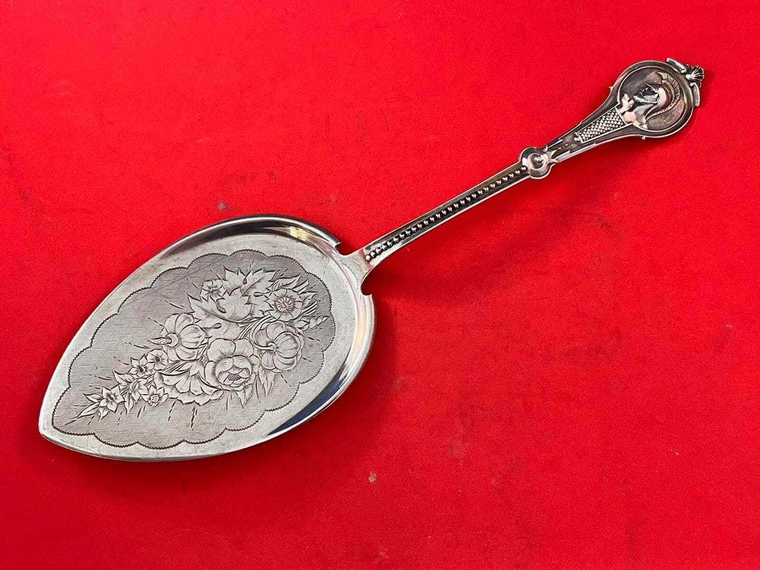 Victorian Wood & Hughes Medallion Coin Silver Pie Server 10 1/4": Victorian Wood & Hughes Medallion Coin Silver Pie Server 10 1/4" This exquisite pie server, known as Medallion or Warrior, is crafted by Wood & Hughes and dates back to the Victorian era, circa 1863.