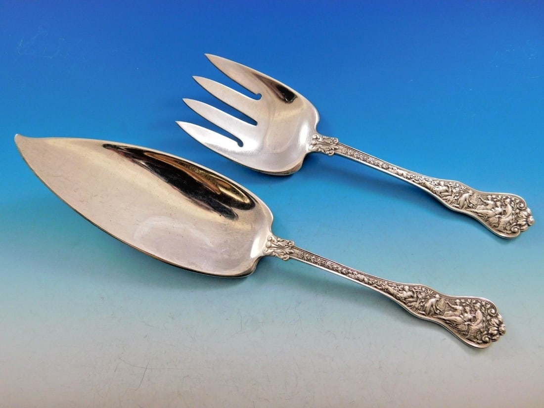Tiffany & Co Olympian Sterling Silver Fish Serving Set 2-Piece: Tiffany & Co Olympian Sterling Silver Fish Serving Set 2-Piece Presenting a stunning 2-piece fish serving set from Tiffany & Co., crafted in sterling silver and featuring the exquisite Olympian patter