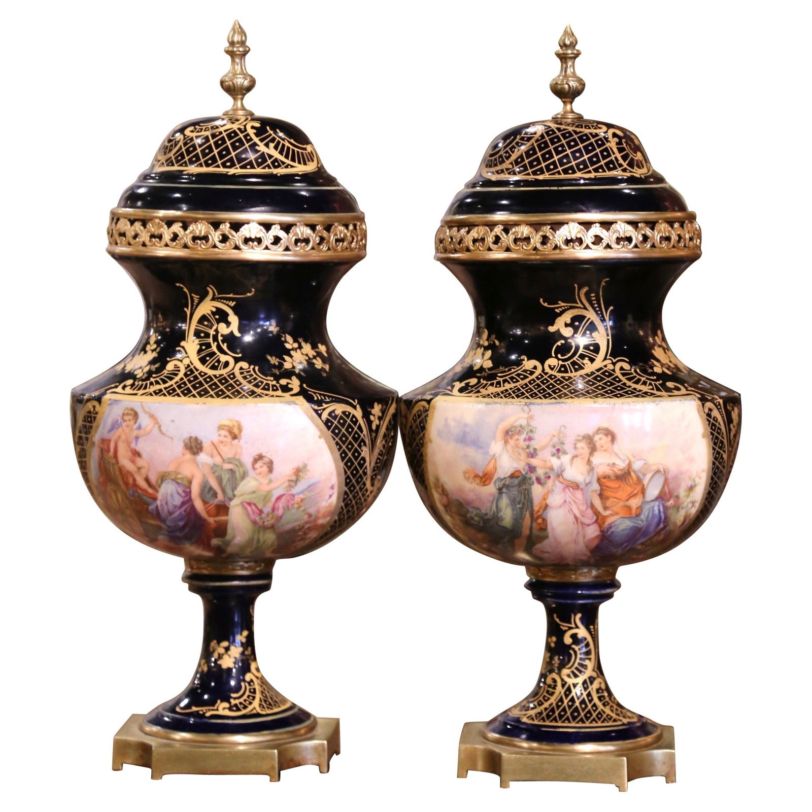 19th Century Sevres Royal Blue Porcelain Bronze Urns Set of 2: 19th Century Sevres Royal Blue Porcelain Bronze Urns Set of 2 This exquisite pair of 19th Century French Sevres urns showcases the elegance of late 19th-century craftsmanship. Attributed to the Manufa