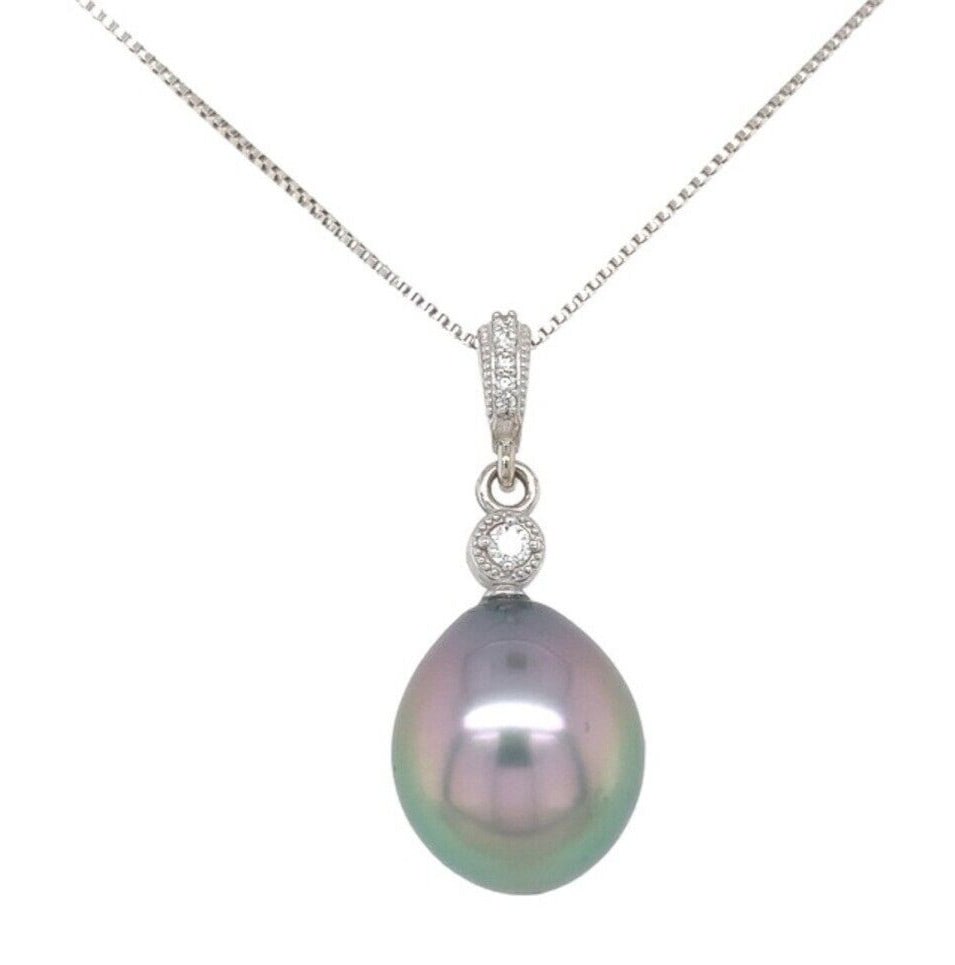 Stunning 14k White Gold Black Tahitian Pearl Pendant with Diamonds: Stunning 14k White Gold Black Tahitian Pearl Pendant with Diamonds This exquisite pendant features a stunning 12.5mm black Tahitian pearl, showcasing beautiful peacock and aubergine overtones. Crafted
