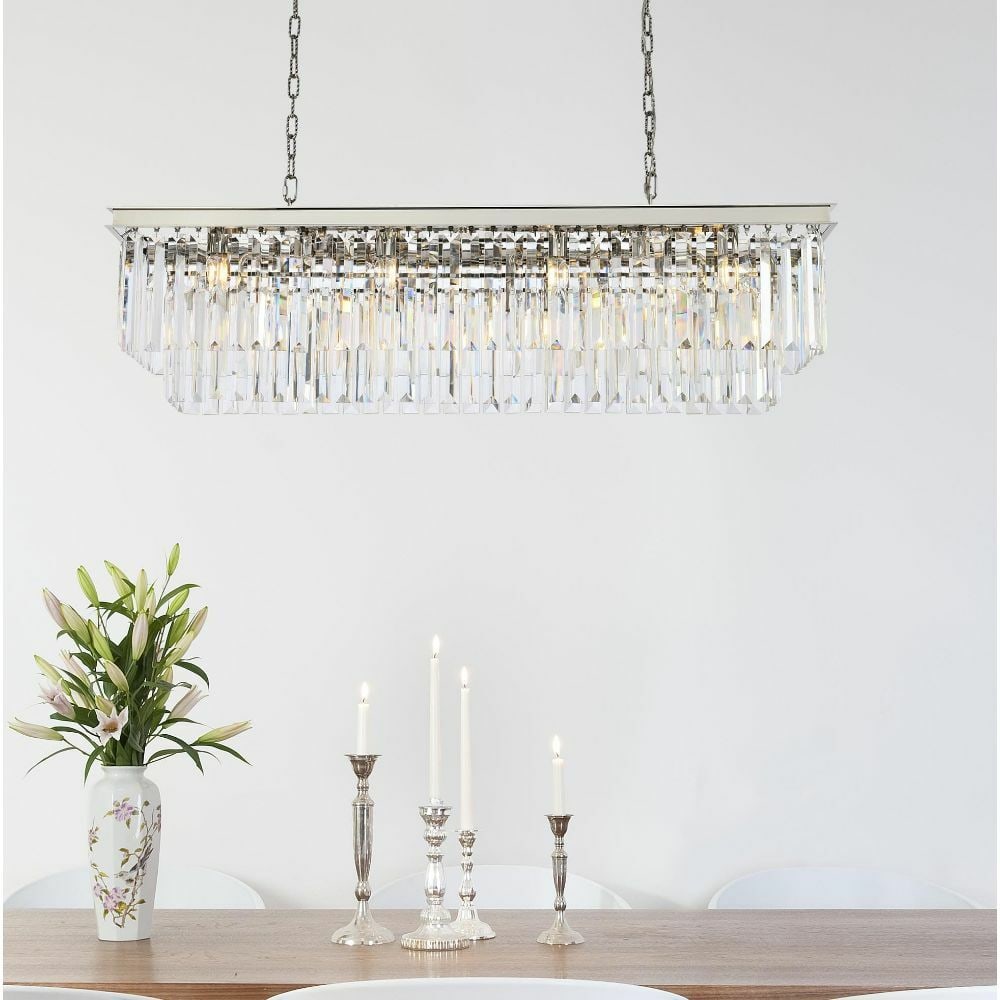 Sydney 12-Light Crystal Chandelier in Polished Nickel 50in Rectangle Modern Fixture: Sydney 12-Light Crystal Chandelier in Polished Nickel 50in Rectangle Modern Fixture This large modern chandelier features a polished nickel frame with clear crystal accents, offering a contemporary lo
