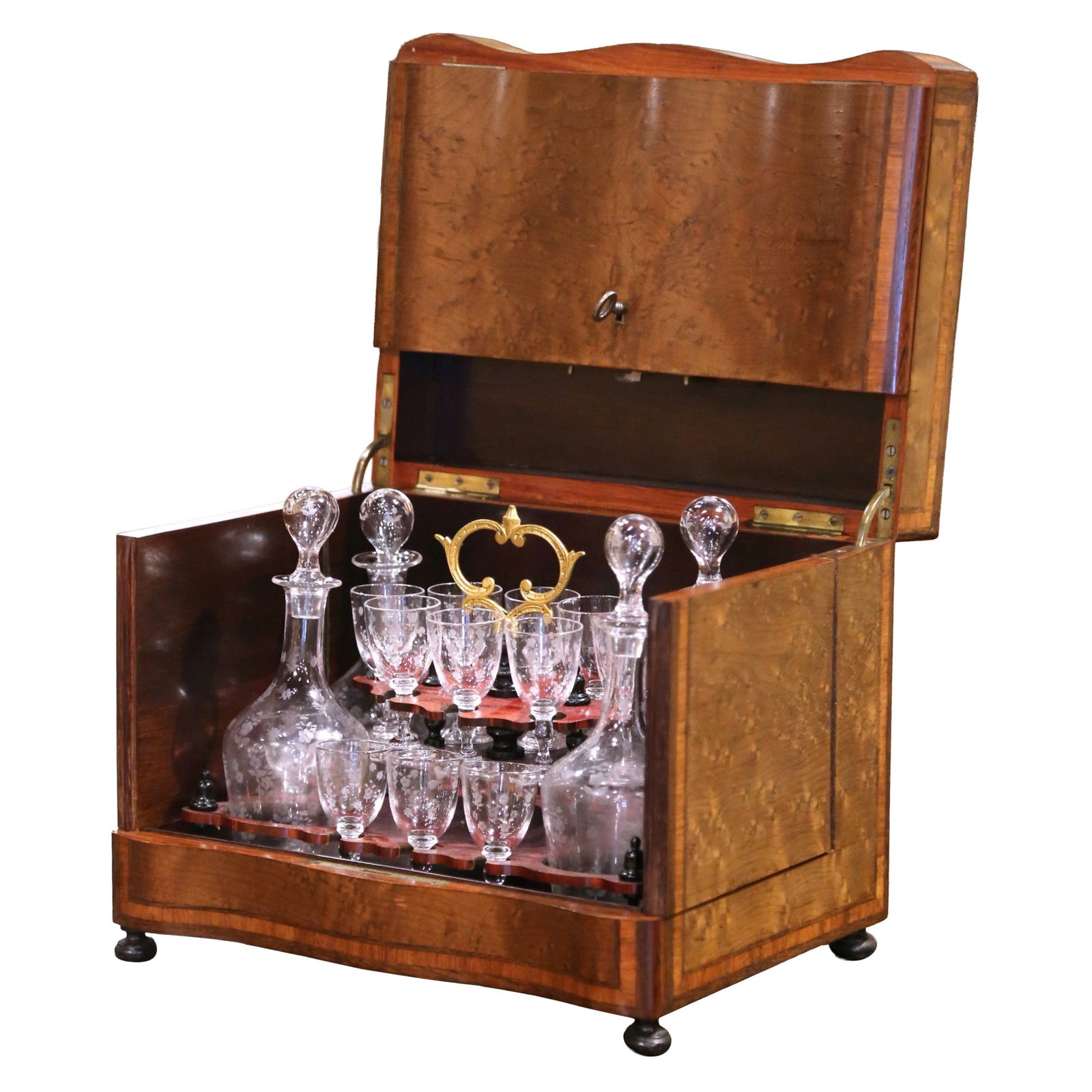 Napoleon III French Burl Walnut Tantalus Set with Four Decanters and Sixteen Cordials: Napoleon III French Burl Walnut Tantalus Set with Four Decanters and Sixteen Cordials This complete 19th-century French Cave a Liqueur is an elegant example of Napoleon III period craftsmanship, made