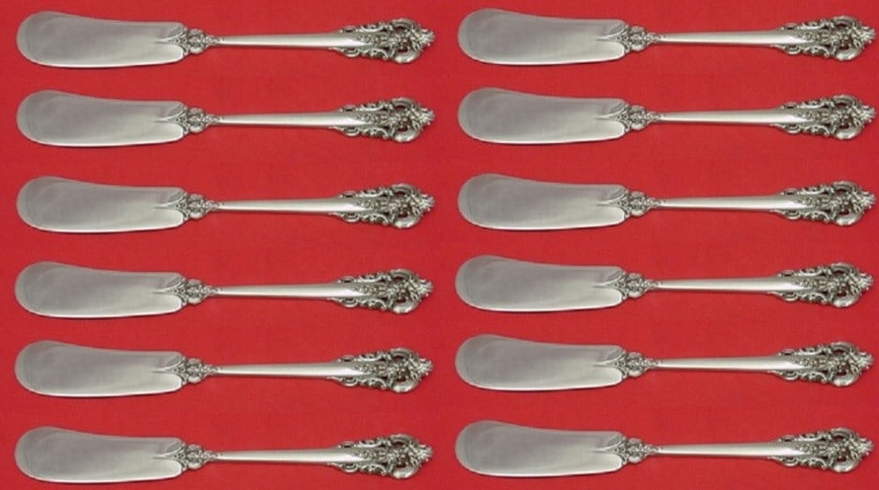 Wallace Grande Baroque Sterling Silver Butter Spreader Set of 12: Wallace Grande Baroque Sterling Silver Butter Spreader Set of 12 This elegant set of 12 butter spreaders features the exquisite Grande Baroque pattern by Wallace, crafted from high-quality sterling si