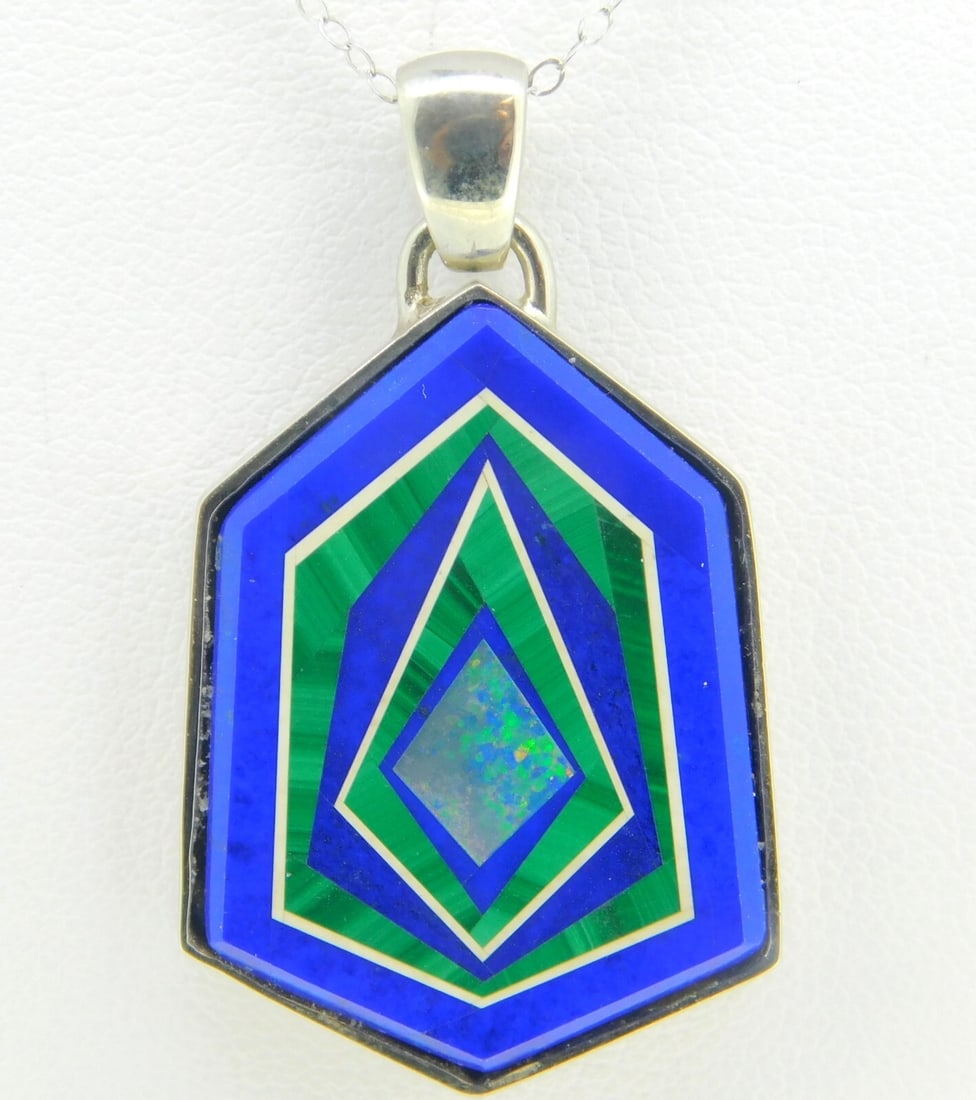 14k White Gold Intarsia Opal Pendant Necklace with Custom Bezel: 14k White Gold Intarsia Opal Pendant Necklace with Custom Bezel This stunning pendant showcases a beautiful intarsia design featuring genuine natural opal inlay complemented by lapis, white agate, and