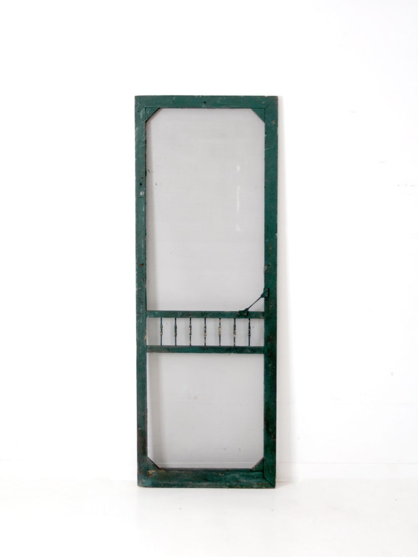 Victorian Antique Screen Door with Dark Cyan Finish: Victorian Antique Screen Door with Dark Cyan Finish This antique Victorian-era screen door showcases a beautifully crafted wood frame with elegant turned detailing. Its stunning dark cyan painted fini