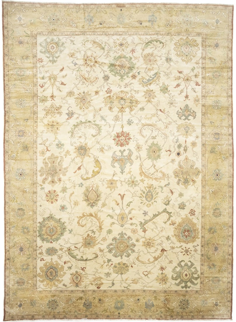 Oversized Floral Wool Area Rug 12'6 x 17' Hand-Knotted Oushak Style: Oversized Floral Wool Area Rug 12'6 x 17' Hand-Knotted Oushak Style This oversized handmade Oushak Turkish-style area rug features a floral pattern in muted tones of cream, beige, gold, brown, and lig