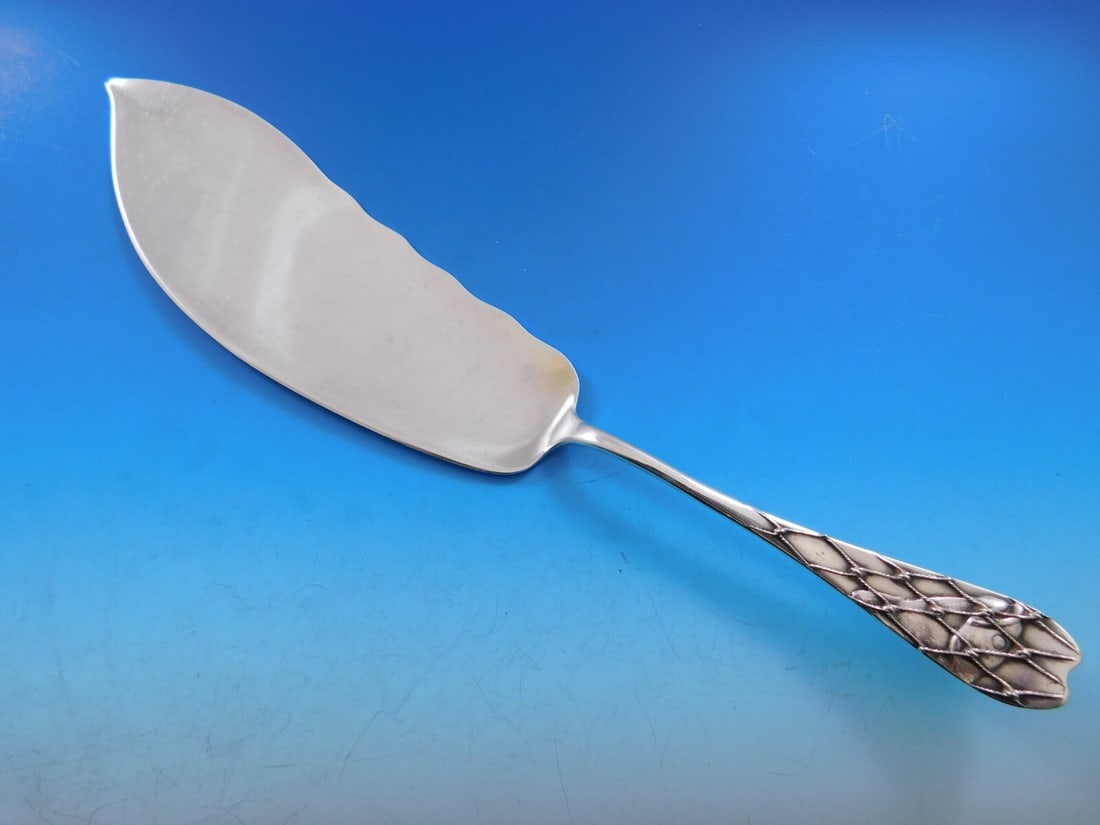 Whiting Sterling Silver Fish Server 12 1/4 Fish in Net Vintage Piece: Whiting Sterling Silver Fish Server 12 1/4 Fish in Net Vintage Piece This exquisite vintage figural fish server from Whiting, measuring 12 1/4", showcases the intricate "Fish in Net" pattern. Crafted