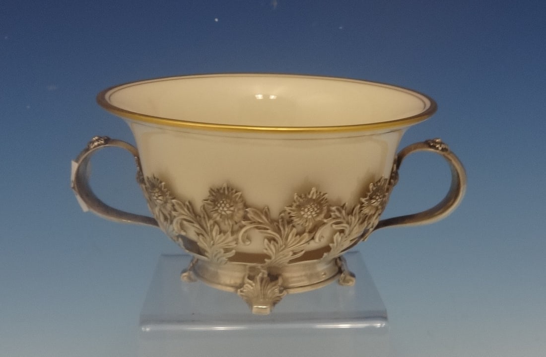 Tiffany & Co Chrysanthemum Sterling Silver Bouillon Cup with Gold Liner: Tiffany & Co Chrysanthemum Sterling Silver Bouillon Cup with Gold Liner This exquisite bouillon cup from Tiffany & Co. features the iconic Chrysanthemum pattern, a hallmark of the Art Nouveau style. C