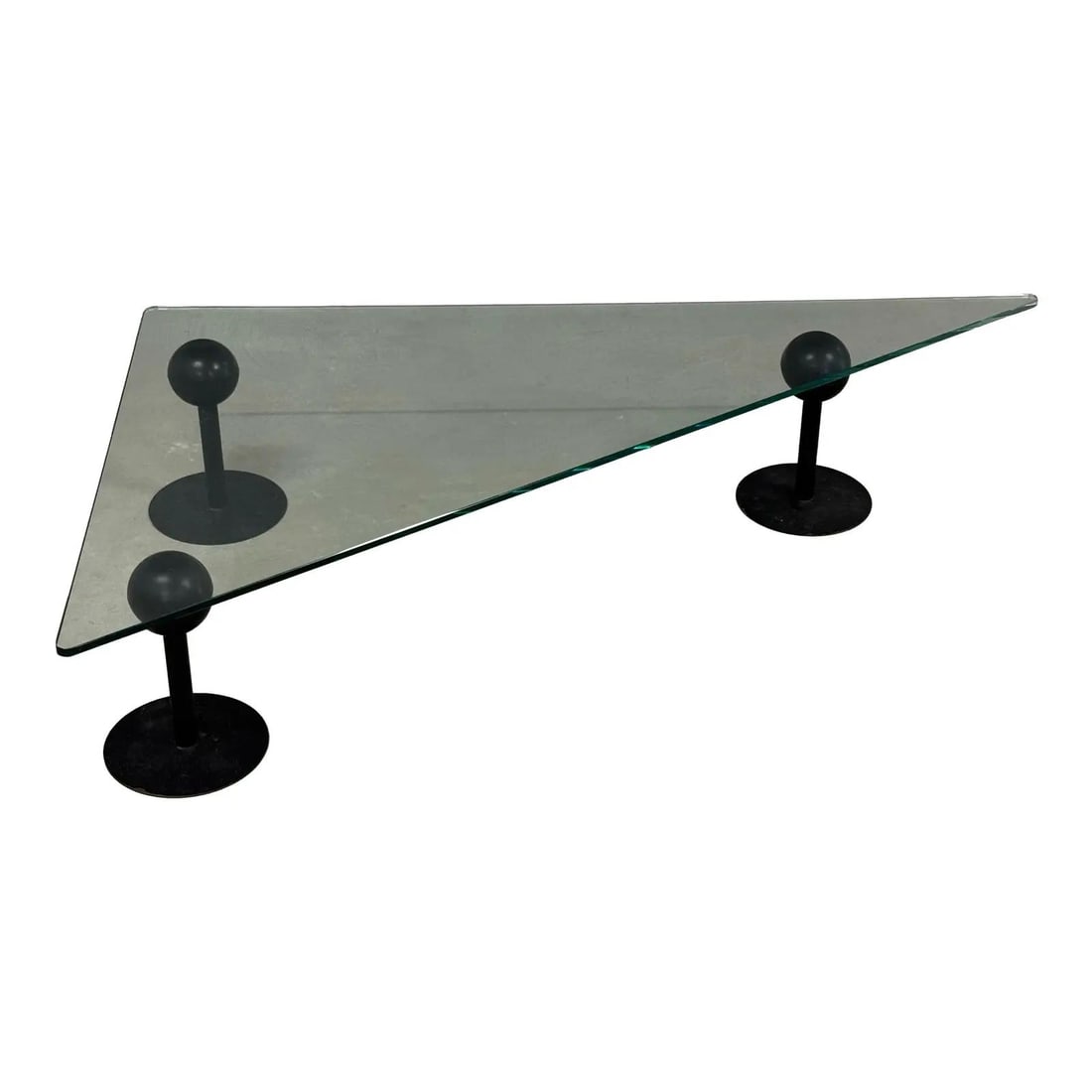 Phillip Stark Memphis Style Glass Coffee Table 1980s: Phillip Stark Memphis Style Glass Coffee Table 1980s Discover this Late 20th Century coffee table designed by Phillip Stark, showcasing a modern Memphis style with a striking triangular glass top. The