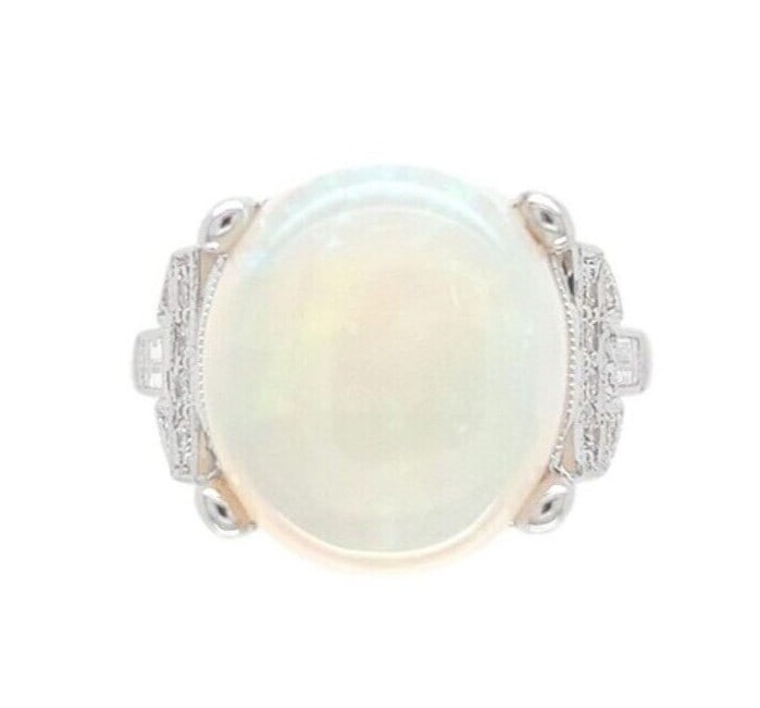 18k White Gold 6.88ct Australian Opal Diamond Ring GIA Certified: 18k White Gold 6.88ct Australian Opal Diamond Ring GIA Certified This stunning 18k white gold ring showcases a large 6.88 carat genuine Australian opal, featuring a captivating play of color in pink-r