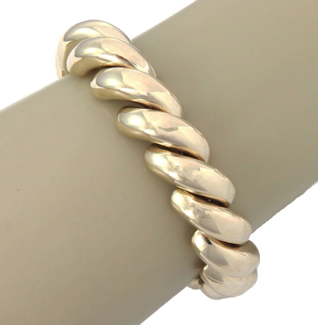 Vintage 14k Yellow Gold San Marco Link Bracelet 13mm Wide: Vintage 14k Yellow Gold San Marco Link Bracelet 13mm Wide This vintage San Marco Macaroni bracelet features a classic link design crafted from high-quality 14k yellow gold. Measuring 13mm in width and