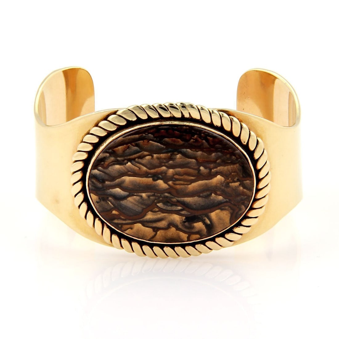 14k Yellow Gold Bangle with Large Oval Marble Jasper Stone: 14k Yellow Gold Bangle with Large Oval Marble Jasper Stone This cuff bracelet features a large oval marble jasper stone set in 14k yellow gold. The bangle cuff design offers both elegance and versatil