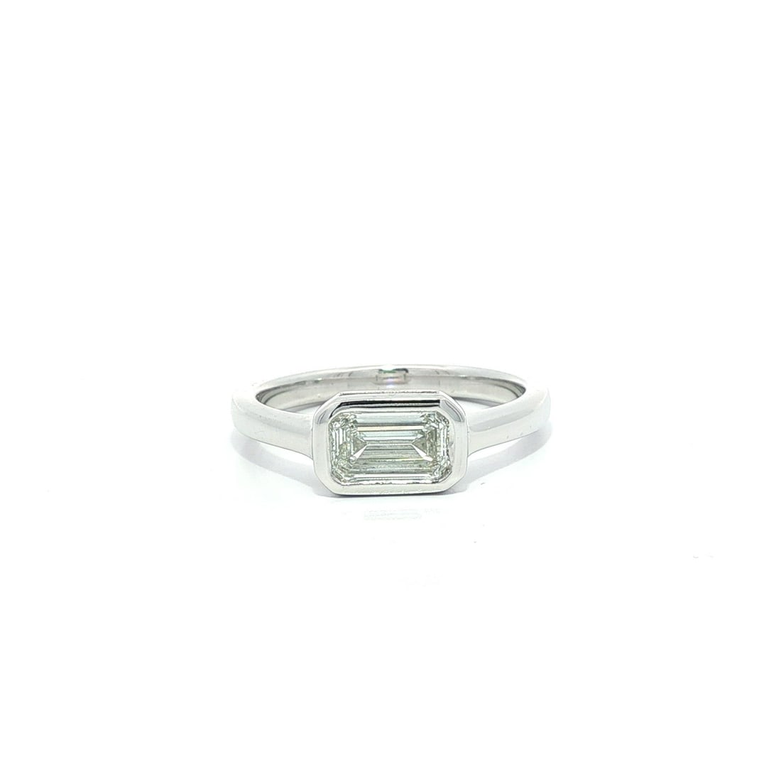 GIA Certified Platinum Ring with 0.80ct Elongated Emerald Diamond Bezel Set: GIA Certified Platinum Ring with 0.80ct Elongated Emerald Diamond Bezel Set This ring features a certified 0.80 carat natural elongated emerald cut diamond set in a bezel solitaire east-west orientati
