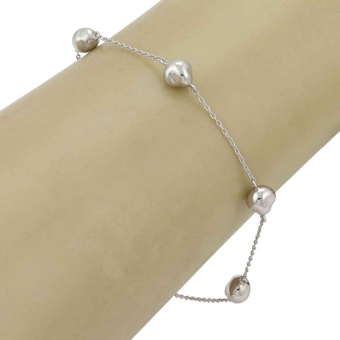 Platinum Charm Bracelet with Five Nugget Accents by Tiffany Peretti: Platinum Charm Bracelet with Five Nugget Accents by Tiffany Peretti This Tiffany & Co. Peretti Platinum 5 Nugget Bracelet is an original vintage charm bracelet crafted from fine platinum. Featuring fi