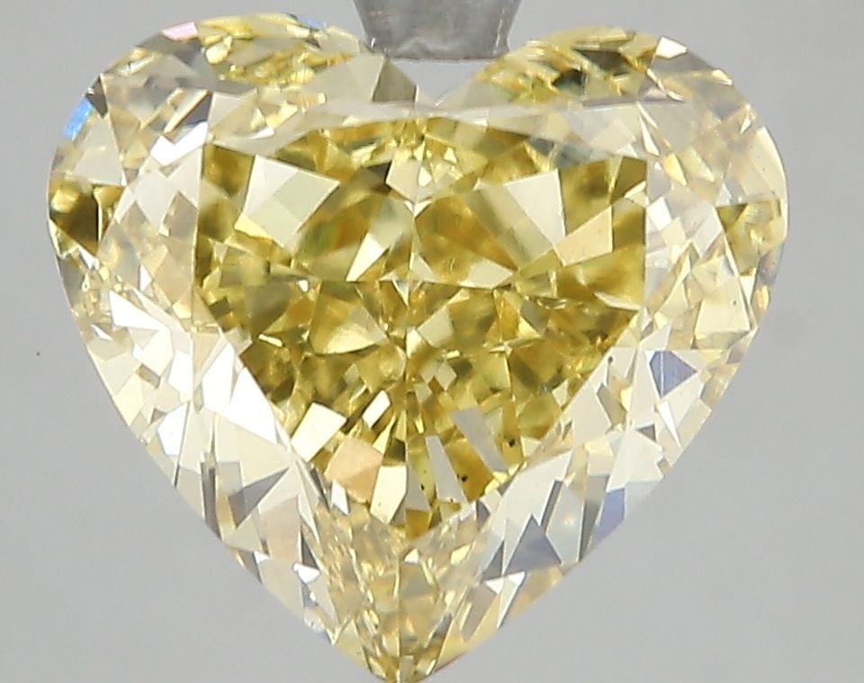 Loose Diamond - HEART 5.54ct Fancy Vivid Yellow VS2: Loose Diamond - HEART 5.54ct Fancy Vivid Yellow VS2 Source: This is a real non-mined Diamond that has been grown in a lab Shape: HEART Carats: 5.54 Color: Fancy Vivid Yellow Certification: IGI