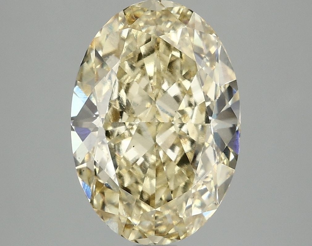 Loose Diamond - OVAL 4.08ct Fancy Vivid Yellow VS2: Loose Diamond - OVAL 4.08ct Fancy Vivid Yellow VS2 Source: This is a real non-mined Diamond that has been grown in a lab Shape: OVAL Carats: 4.08 Color: Fancy Vivid Yellow Certification: IGI Video: