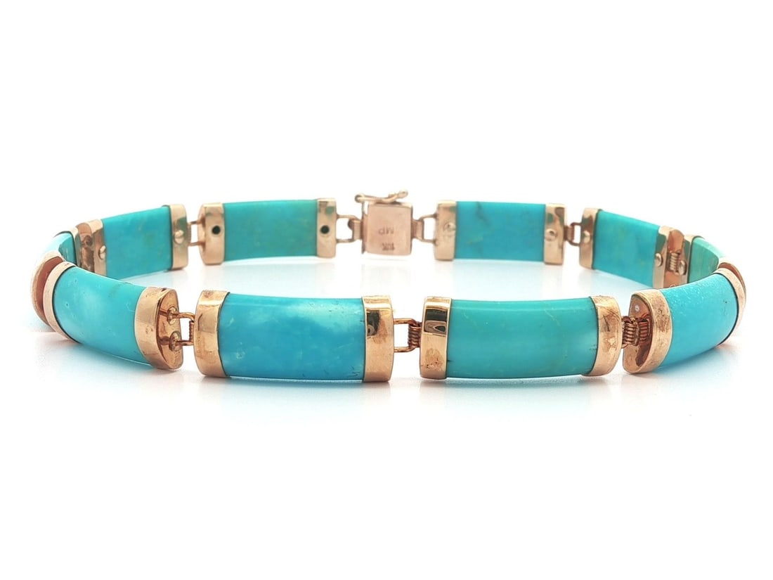 Yellow Gold Natural Turquoise Link Bracelet with Asian Clasp: Yellow Gold Natural Turquoise Link Bracelet with Asian Clasp This stunning Yellow Gold Turquoise Section Line Link Bracelet showcases a beautiful design featuring natural turquoise stones. The bracele