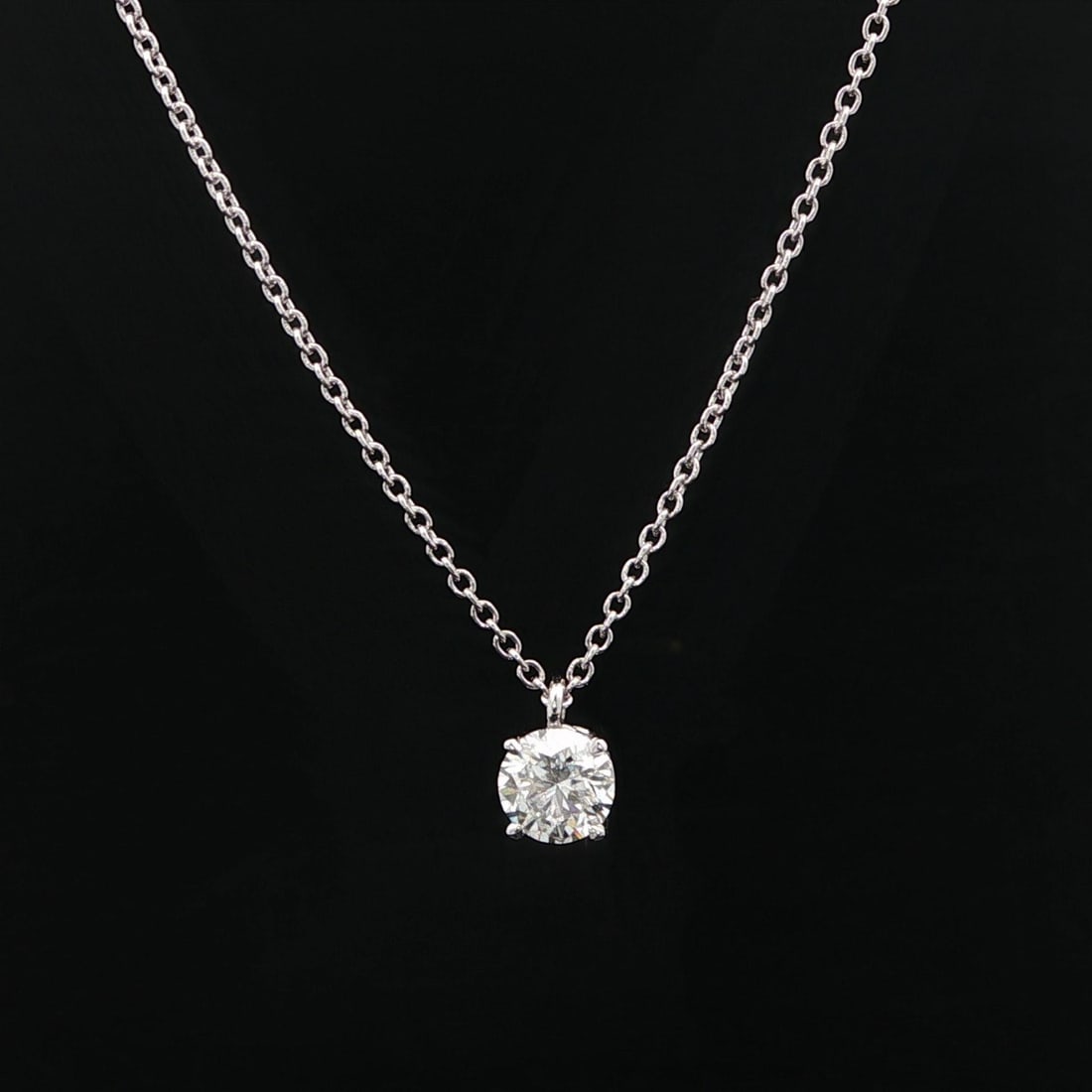 GIA Certified 0.57ct D SI1 Diamond Pendant on 14k White Gold Necklace: GIA Certified 0.57ct D SI1 Diamond Pendant on 14k White Gold Necklace This un-used necklace features a natural round brilliant cut diamond, weighing 0.57 carats with D color and SI1 clarity, certified