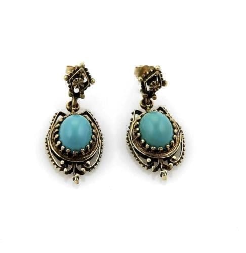Vintage 14k Gold Drop Earrings with Oval Turquoise Stones: Vintage 14k Gold Drop Earrings with Oval Turquoise Stones This pair of vintage dangle earrings features oval turquoise stones set in 14k yellow gold. The earrings have a classic drop style and are hal