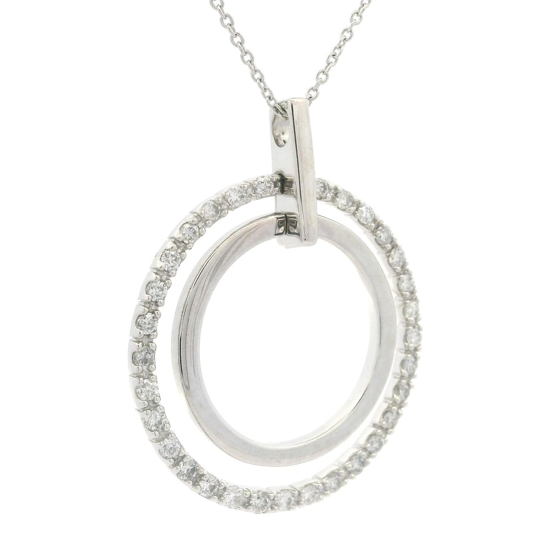 18K White Gold 0.60ctw Diamond Dual Circle Pendant Necklace 20": 18K White Gold 0.60ctw Diamond Dual Circle Pendant Necklace 20" Elevate your style with this stunning White Gold Dual Circle Pendant featuring 31 natural, genuine diamonds in a round brilliant cut, to