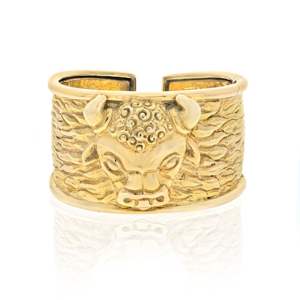 David Webb 1979 18K Yellow Gold Taurus Bull Hinged Cuff Bracelet: David Webb 1979 18K Yellow Gold Taurus Bull Hinged Cuff Bracelet Discover the elegance of this vintage David Webb cuff bracelet from the Taurus collection, created in 1979. Crafted from textured and p