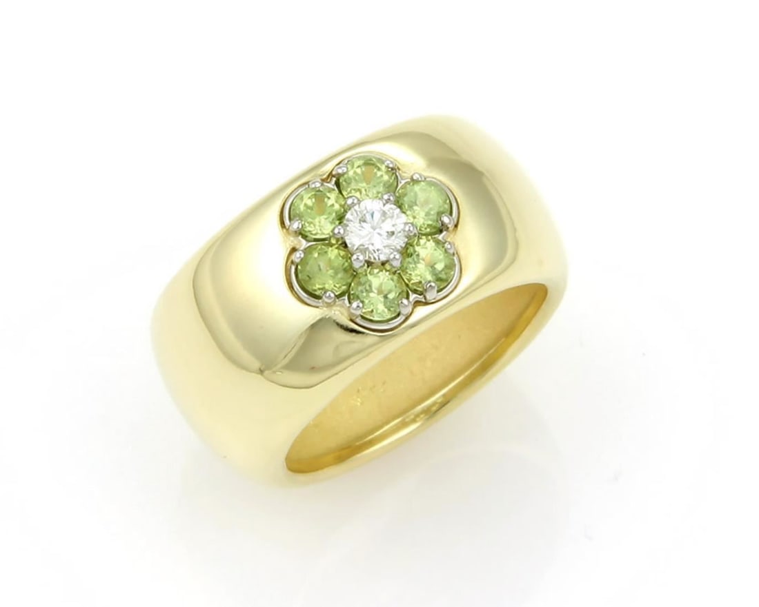 18k Yellow Gold Wide Floral Band Ring with Peridot and Diamond by Hammerman Brothers Size 6: 18k Yellow Gold Wide Floral Band Ring with Peridot and Diamond by Hammerman Brothers Size 6 This Hammerman Brothers ring is crafted from 18k yellow gold with a satin finish and features a wide band ad