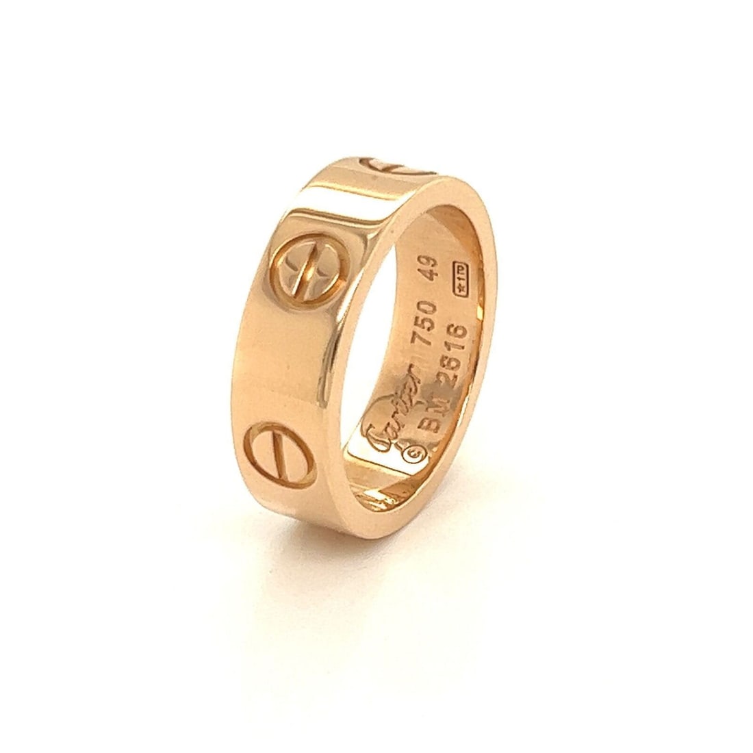Love Collection Pink Gold 18k Ring by Cartier Size 4.5 with Authentication: Love Collection Pink Gold 18k Ring by Cartier Size 4.5 with Authentication This Cartier Love ring is crafted from 18k pink gold and features the signature of the brand. The band measures 5.5mm in widt