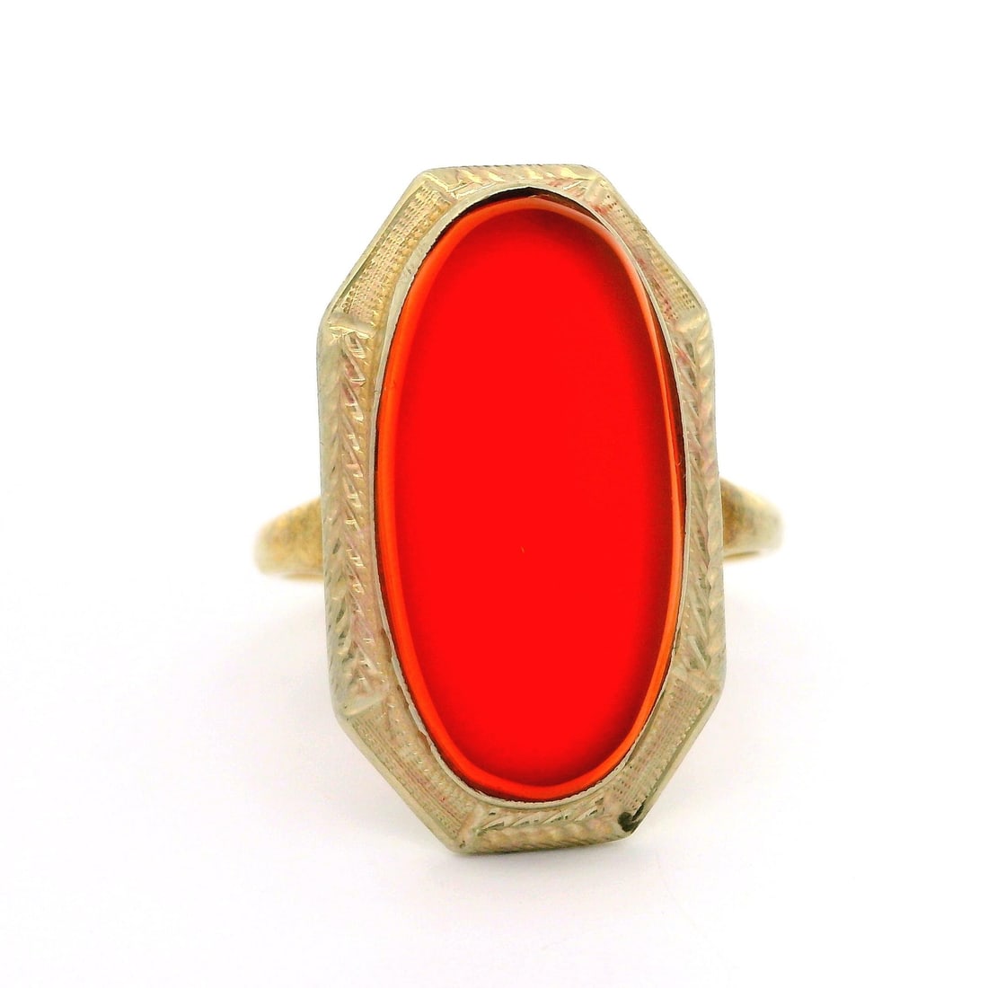 Antique Art Deco 14k Gold Oval Carnelian Cocktail Ring: Antique Art Deco 14k Gold Oval Carnelian Cocktail Ring This stunning Antique Art Deco cocktail ring showcases a vibrant, deep orange oval cut genuine carnelian, measuring approximately 19.08 x 9.68mm.