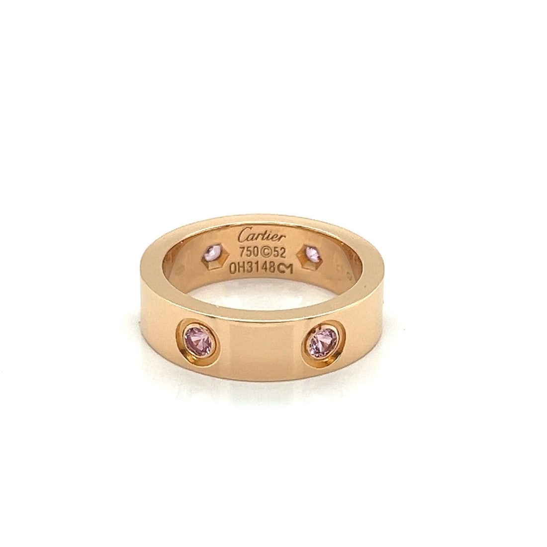 Cartier Love Band 18k Pink Gold Ring with Six Pink Sapphires Size 6 and Paper: Cartier Love Band 18k Pink Gold Ring with Six Pink Sapphires Size 6 and Paper This Cartier Love band ring is crafted in 18k pink gold and features six pink sapphire stones, each measuring 2mm. The rin
