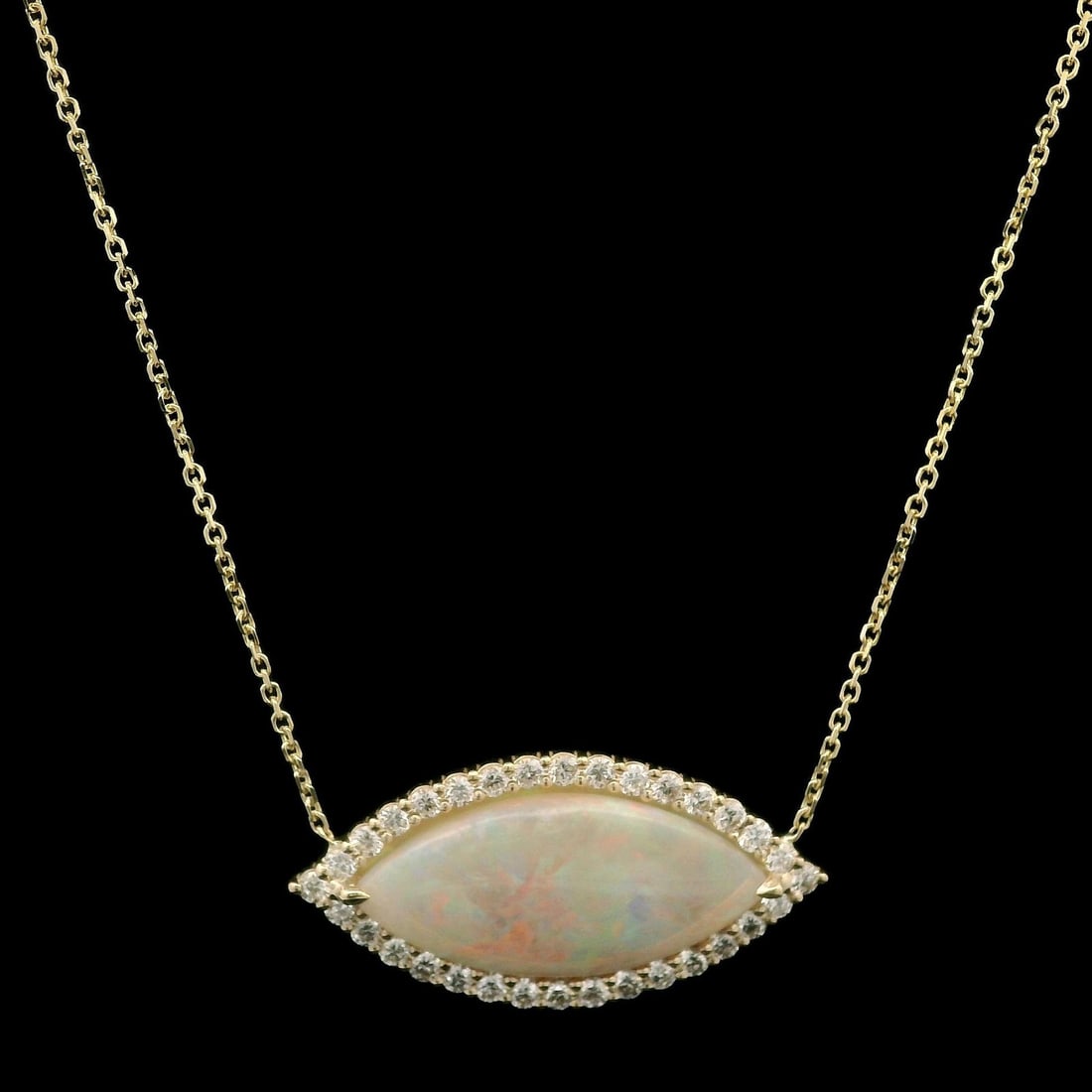 New 14k Gold 4.49ctw Opal Diamond Halo Pendant Necklace: New 14k Gold 4.49ctw Opal Diamond Halo Pendant Necklace This exquisite adjustable necklace features a stunning pendant crafted from solid 14k yellow gold, showcasing a breathtaking natural marquise op