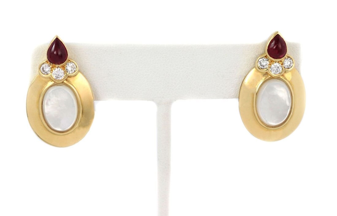 Dior 18k Yellow Gold Stud Earrings with Diamonds Rubies and Mother of Pearl: Dior 18k Yellow Gold Stud Earrings with Diamonds Rubies and Mother of Pearl These stud earrings feature diamonds, rubies, and mother of pearl set in 18k yellow gold. Signed by Dior, they showcase an e