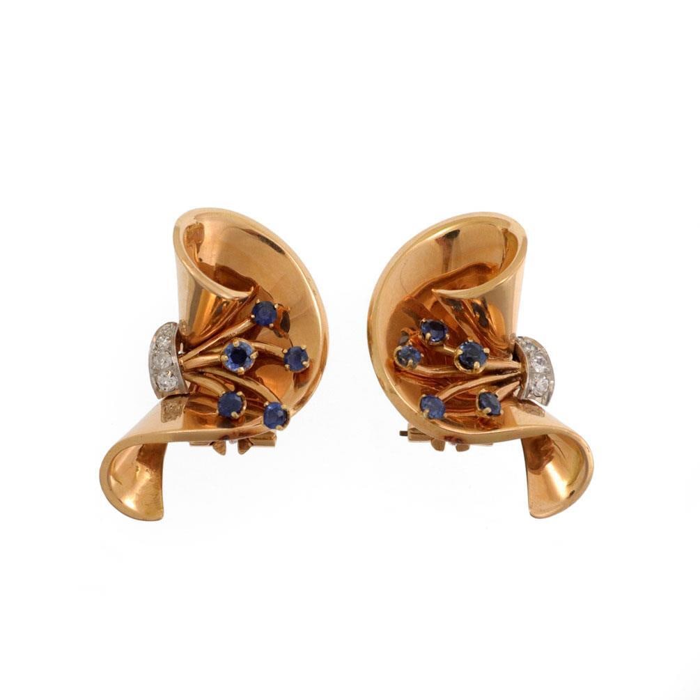 French Retro 1.12ct Sapphire Diamond 18k Rose Gold Clip-On Earrings: French Retro 1.12ct Sapphire Diamond 18k Rose Gold Clip-On Earrings These exquisite Retro fan flare clip-on earrings are beautifully crafted from 18k rose gold, showcasing French markings. The earring