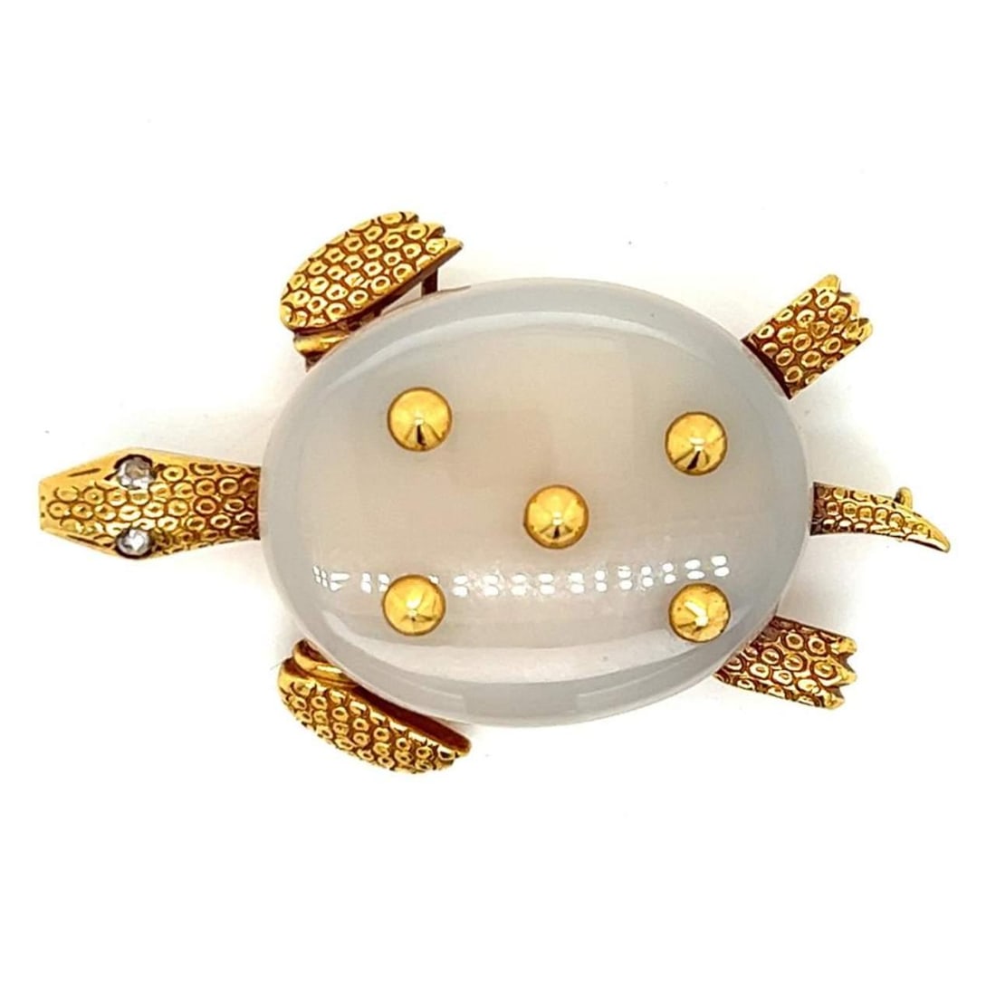 1960s Cartier Paris 18K Yellow Gold Chalcedony Turtle Brooch: 1960s Cartier Paris 18K Yellow Gold Chalcedony Turtle Brooch This exquisite brooch from Cartier Paris, dating back to the 1960s, showcases a charming turtle design crafted from 18K yellow gold, comple