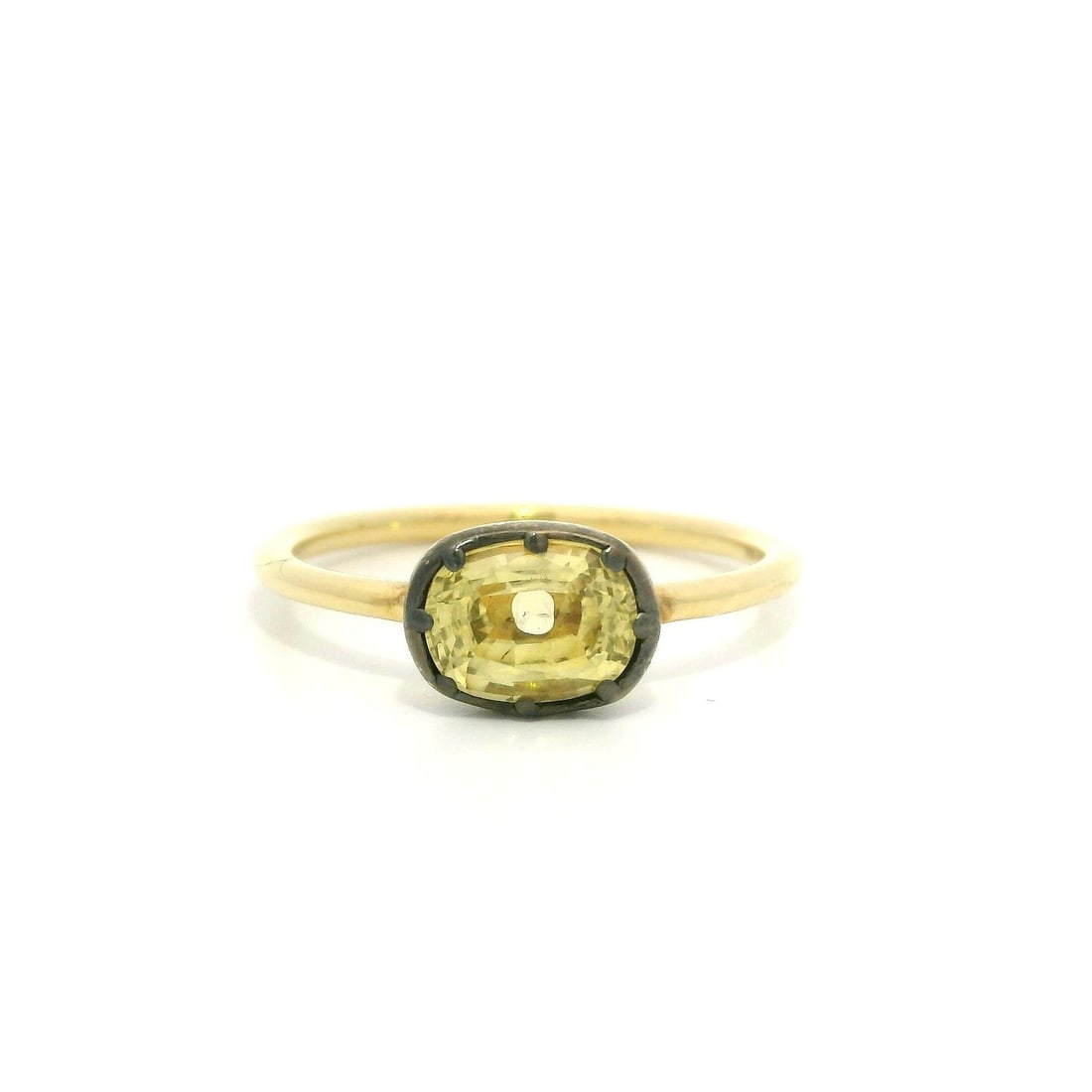 18k Gold Blackened Silver GIA 1.20ct Yellow Sapphire Ring: 18k Gold Blackened Silver GIA 1.20ct Yellow Sapphire Ring Introducing a stunning collet set ring featuring a natural yellow sapphire, certified by GIA. This exquisite piece is crafted from solid 18k y