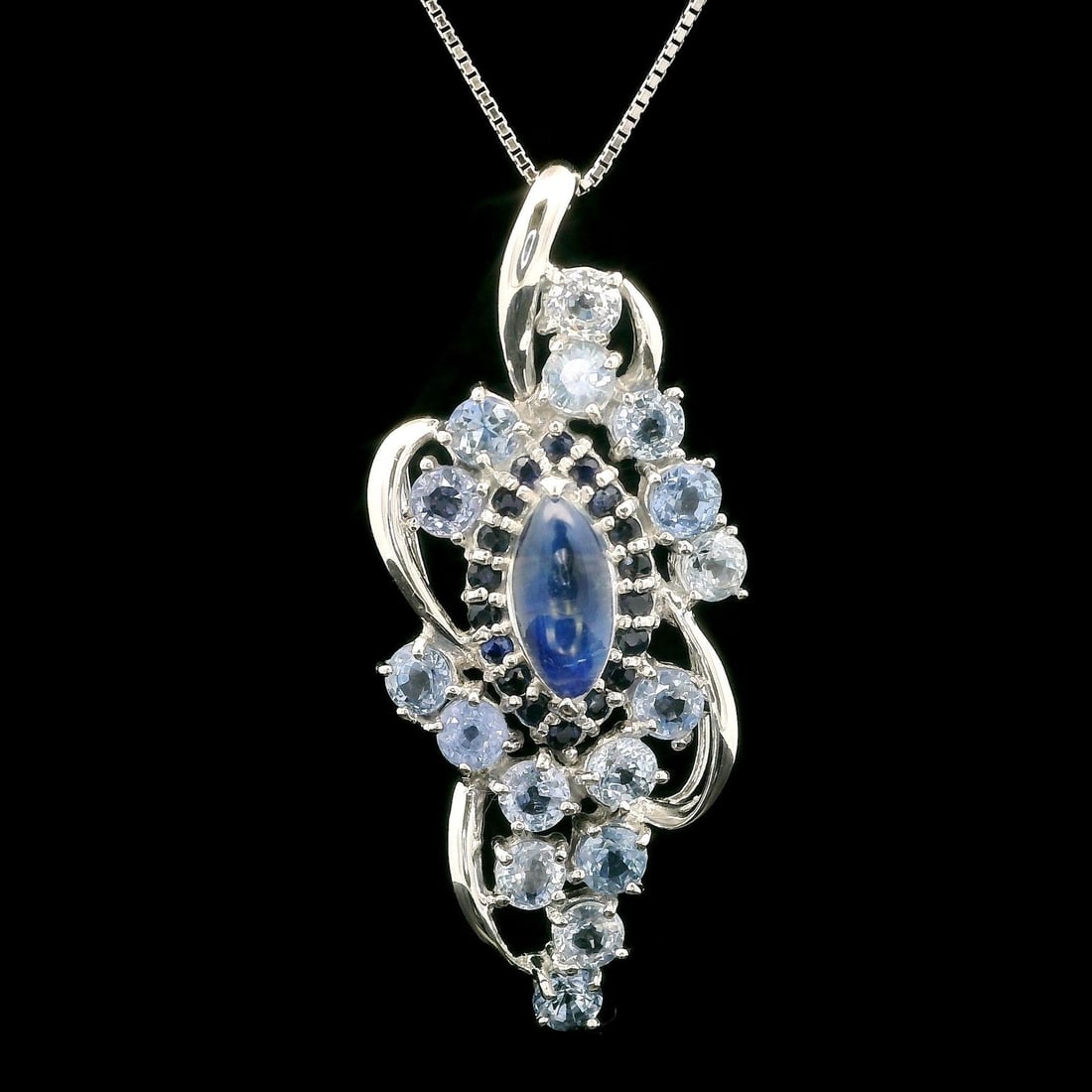 Adjustable 18k White Gold Moonstone Sapphire Pendant Necklace 5.31ctw: Adjustable 18k White Gold Moonstone Sapphire Pendant Necklace 5.31ctw This exquisite adjustable necklace features a stunning pendant crafted from solid 18k white gold. The centerpiece is a natural gen