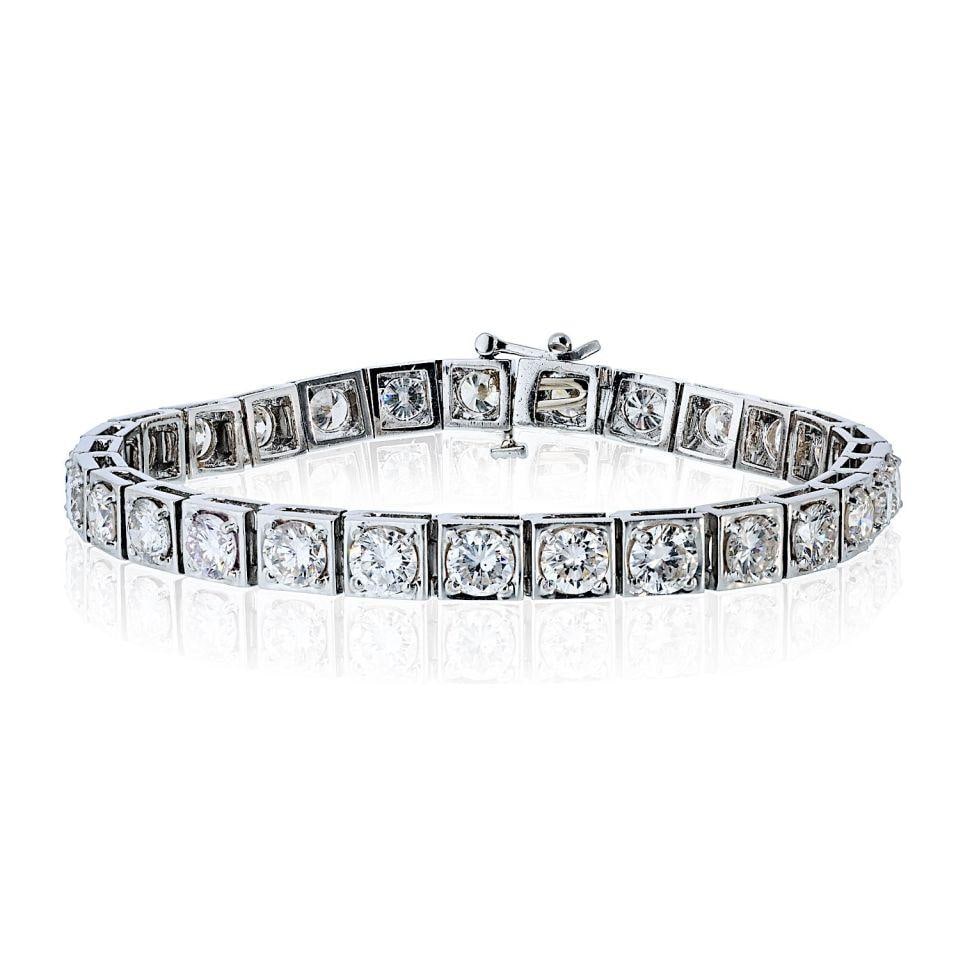 Platinum Tennis Bracelet with 28 Round Diamonds Totaling 14.00 Carats: Platinum Tennis Bracelet with 28 Round Diamonds Totaling 14.00 Carats This vintage platinum tennis bracelet features 28 round brilliant cut natural diamonds with a total weight of approximately 14.00