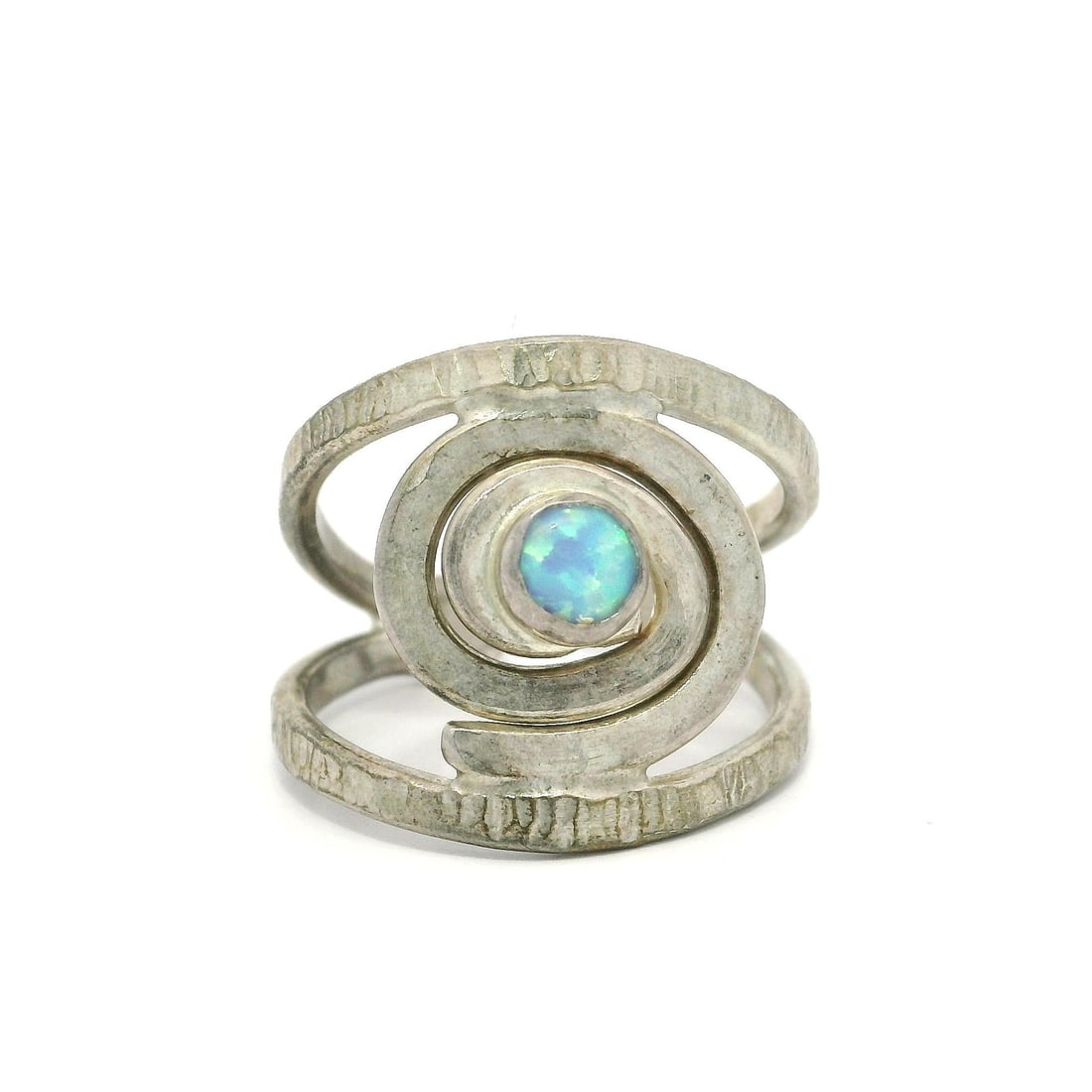 Handmade Sterling Silver Adjustable Opal Swirl Band Ring: Handmade Sterling Silver Adjustable Opal Swirl Band Ring This stunning handmade ring features a unique swirl design crafted from high-quality sterling silver (.925). The centerpiece is a lab-created s