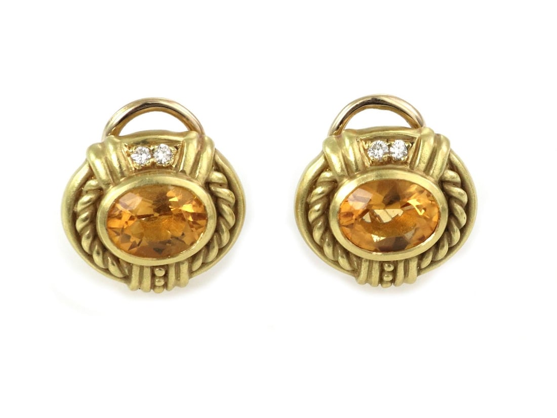 Judith Ripka 18k Yellow Gold Diamond Citrine Clip-On Earrings: Judith Ripka 18k Yellow Gold Diamond Citrine Clip-On Earrings Elevate your elegance with these exquisite Judith Ripka earrings, crafted from luxurious 18k yellow gold. The textured oval-shaped huggie