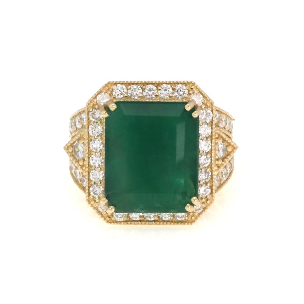 Stunning 14k Yellow Gold Diamond Emerald Cocktail Ring: Stunning 14k Yellow Gold Diamond Emerald Cocktail Ring This exquisite cocktail ring showcases a large, vibrant emerald at its center, surrounded by a halo of diamonds set in luxurious 14k yellow gold.