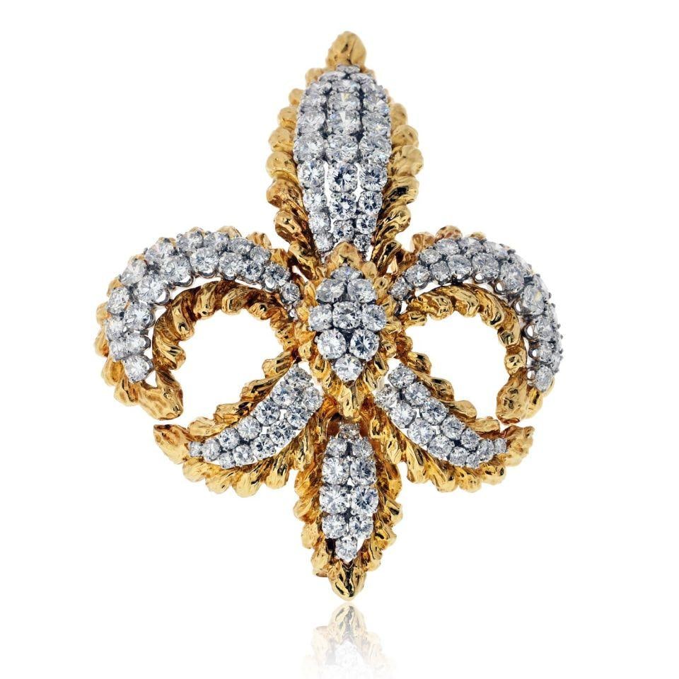 Fleur-de-lis Brooch in Platinum and 18K Yellow Gold by David Webb: Fleur-de-lis Brooch in Platinum and 18K Yellow Gold by David Webb This pre-owned David Webb Fleur-de-lis brooch is crafted from platinum and 18K yellow gold. The brooch features a classic Fleur-de-lis